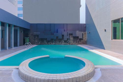 Imagen general del Hotel Super OYO Townhouse 2 Hotel Gunung Sahari. Foto 10