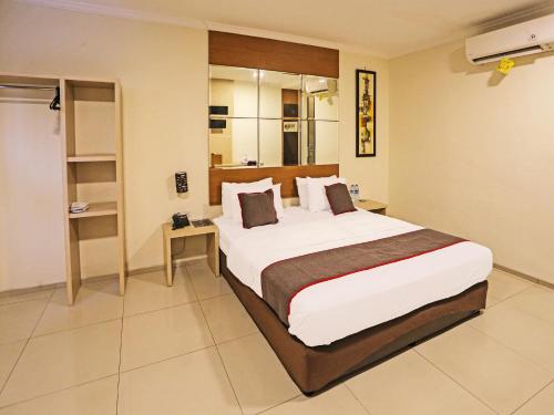 Imagen de la habitación del Hotel Super OYO Townhouse OAK Fiducia Serpong. Foto 18