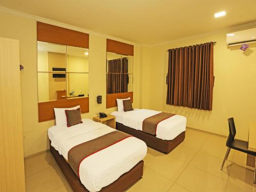 Imagen de la habitación del Hotel Super OYO Townhouse OAK Fiducia Serpong. Foto 19