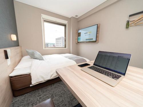 Imagen de la habitación del Hotel Super Premier Sendai Kokubuncho Tennenonsen. Foto 12