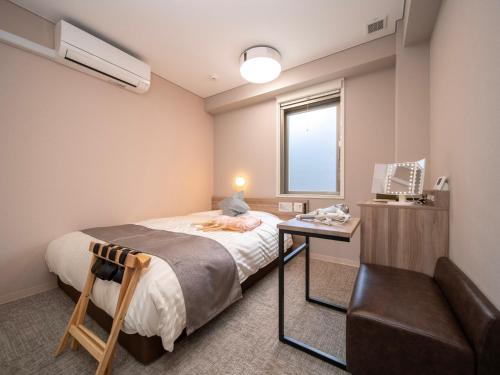 Imagen de la habitación del Hotel Super Premier Sendai Kokubuncho Tennenonsen. Foto 14