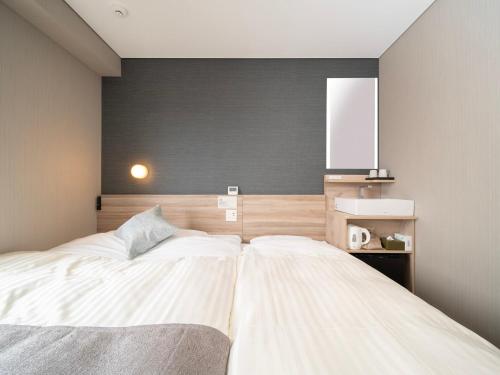 Imagen de la habitación del Hotel Super Premier Sendai Kokubuncho Tennenonsen. Foto 20