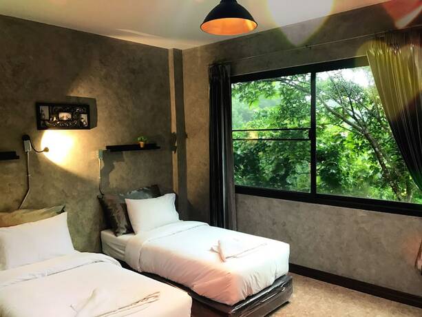 Imagen de la habitación del Hotel Sut Jai House. Foto 12