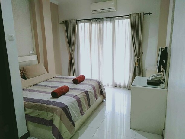 Imagen de la habitación del Hotel Sutan Raja Guest House. Foto 2