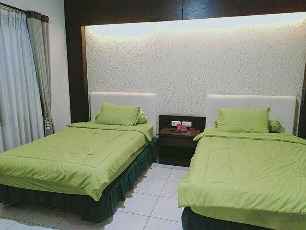 Imagen de la habitación del Hotel Sutan Raja Guest House. Foto 12