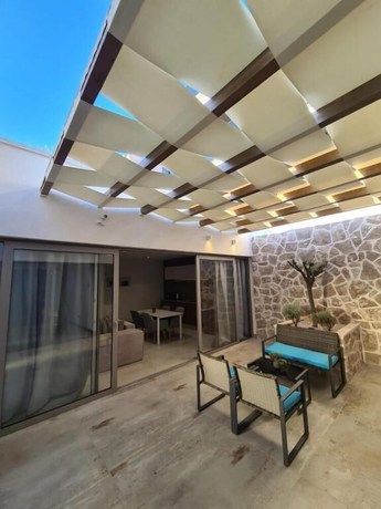 Imagen de la habitación del Hotel Sutivan Luxury Apartments. Foto 18