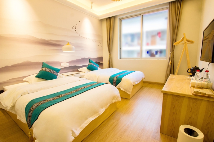 Imagen de la habitación del Hotel Suxi Weishe Guest House. Foto 6