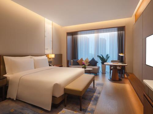 Imagen de la habitación del Hotel Suzhou International Conference. Foto 11