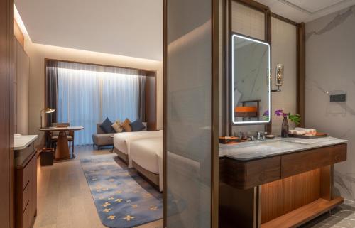 Imagen de la habitación del Hotel Suzhou International Conference. Foto 12