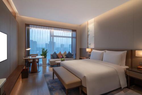 Imagen de la habitación del Hotel Suzhou International Conference. Foto 13