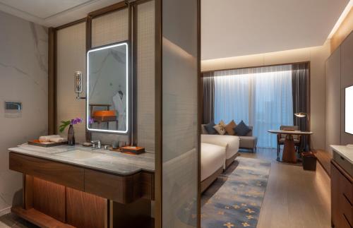 Imagen de la habitación del Hotel Suzhou International Conference. Foto 14