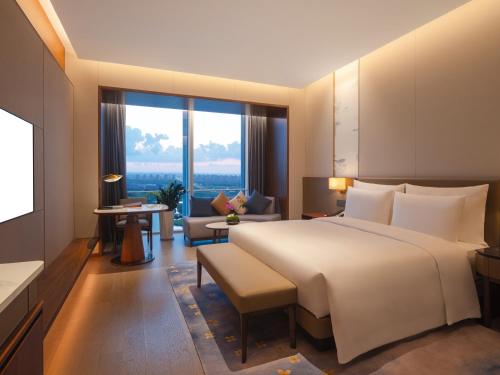 Imagen de la habitación del Hotel Suzhou International Conference. Foto 15