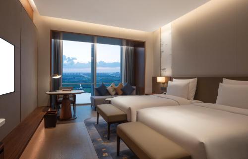 Imagen de la habitación del Hotel Suzhou International Conference. Foto 16