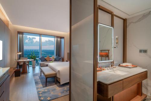 Imagen de la habitación del Hotel Suzhou International Conference. Foto 17