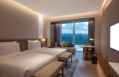 Imagen de la habitación del Hotel Suzhou International Conference. Foto 18