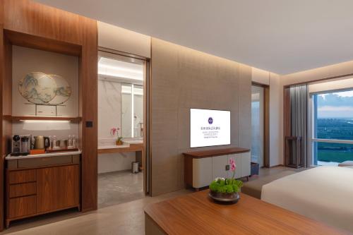 Imagen de la habitación del Hotel Suzhou International Conference. Foto 19