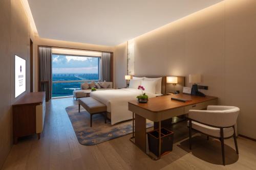Imagen de la habitación del Hotel Suzhou International Conference. Foto 20