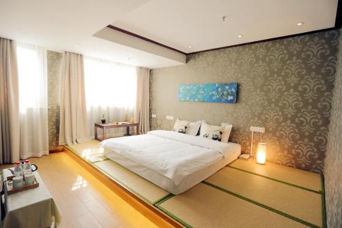 Imagen de la habitación del Hotel Suzhou Jade Snow Lodge. Foto 6