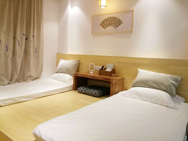 Imagen de la habitación del Hotel Suzhou Leisure Guest House. Foto 12