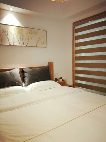 Imagen de la habitación del Hotel Suzhou Leisure Guest House. Foto 13