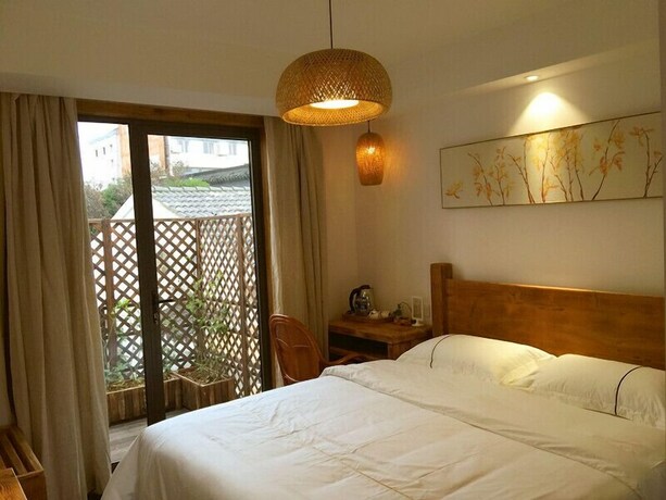 Imagen de la habitación del Hotel Suzhou Leisure Guest House. Foto 14