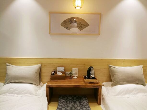 Imagen de la habitación del Hotel Suzhou Leisure Guest House. Foto 17