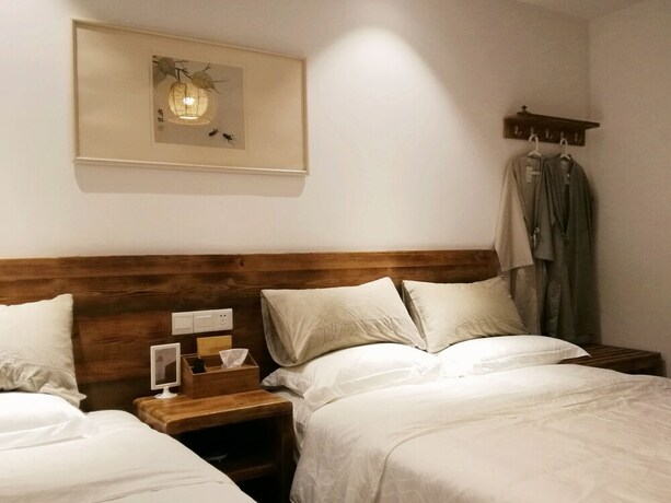 Imagen de la habitación del Hotel Suzhou Leisure Guest House. Foto 18