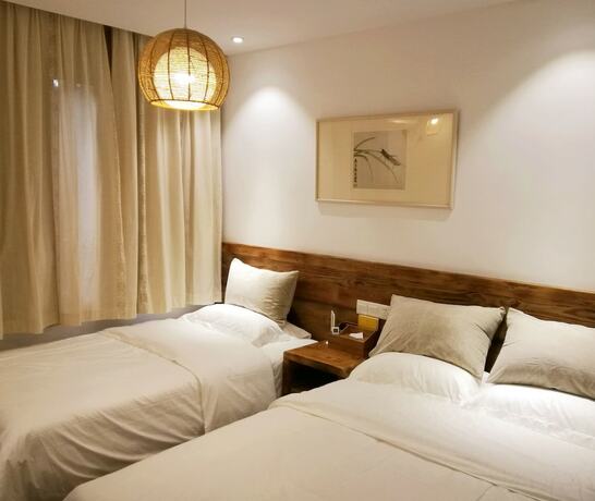Imagen de la habitación del Hotel Suzhou Leisure Guest House. Foto 19