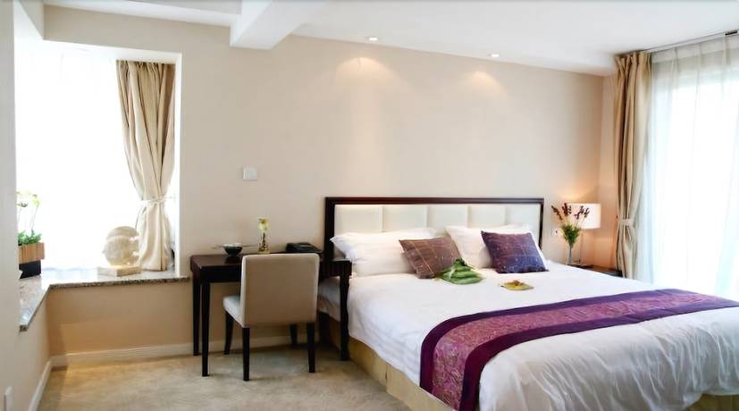 Imagen de la habitación del Hotel Suzhou Regalia Serviced Residences. Foto 13