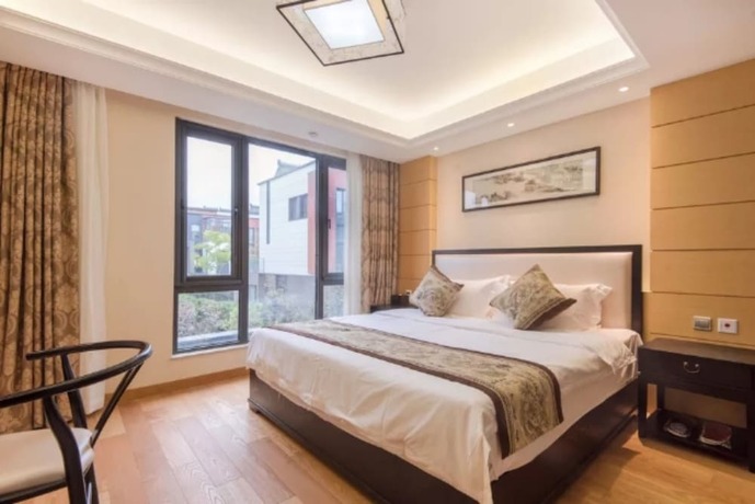 Imagen de la habitación del Hotel Suzhou Taihu Meilanju House. Foto 23