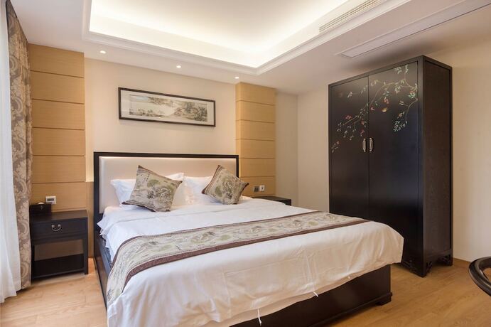 Imagen de la habitación del Hotel Suzhou Taihu Meilanju House. Foto 24