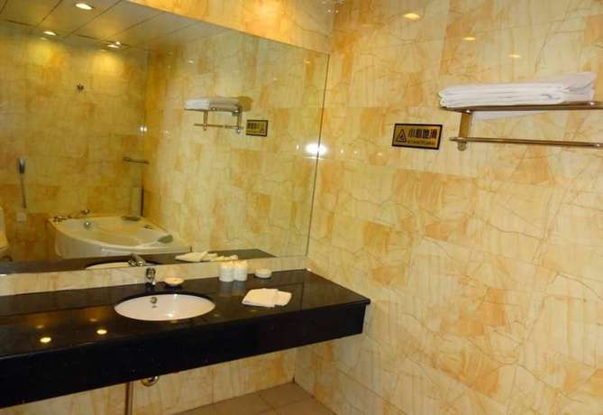 Imagen de la habitación del Hotel Swan Lake Spring Vacation Village - Tianjin. Foto 5