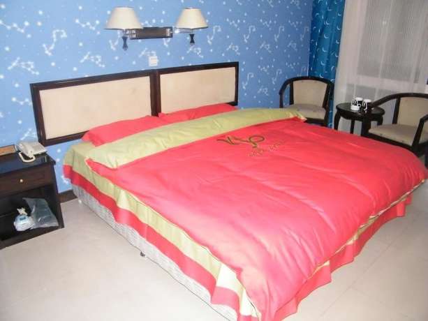 Imagen de la habitación del Hotel Swan Lake Spring Vacation Village - Tianjin. Foto 9