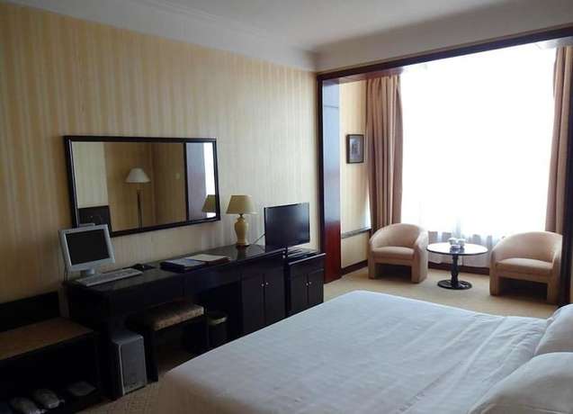 Imagen de la habitación del Hotel Swan Lake Spring Vacation Village - Tianjin. Foto 11