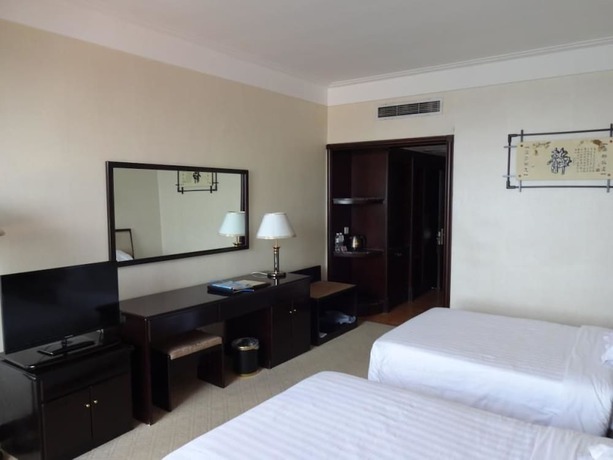 Imagen de la habitación del Hotel Swan Lake Spring Vacation Village - Tianjin. Foto 20