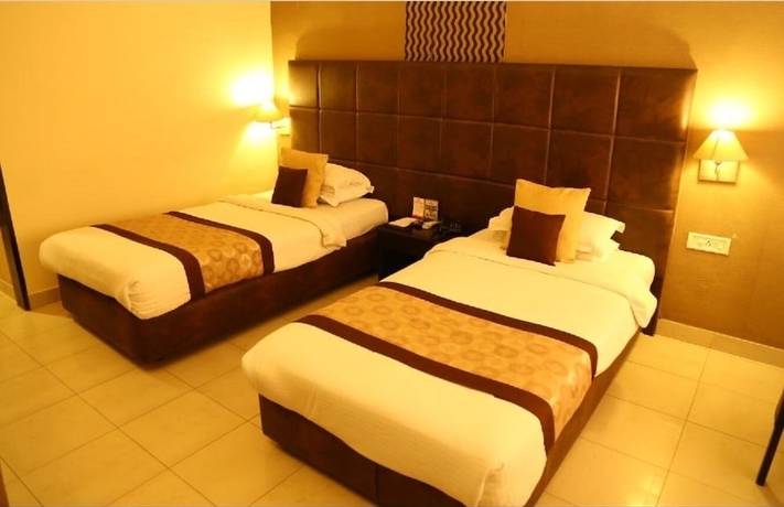 Imagen de la habitación del Hotel Swarn Towers. Foto 13