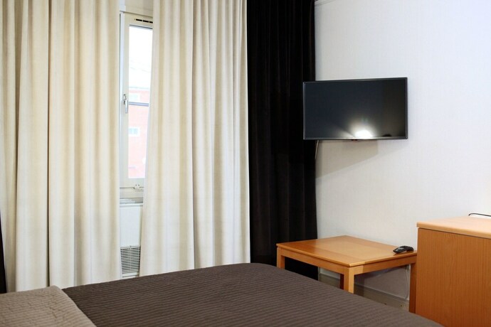 Imagen de la habitación del Hotel Swedish Village. Foto 14