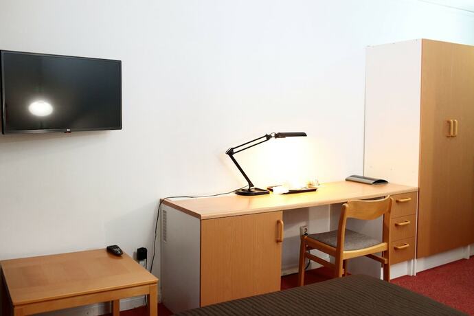 Imagen de la habitación del Hotel Swedish Village. Foto 16
