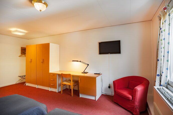 Imagen de la habitación del Hotel Swedish Village. Foto 20