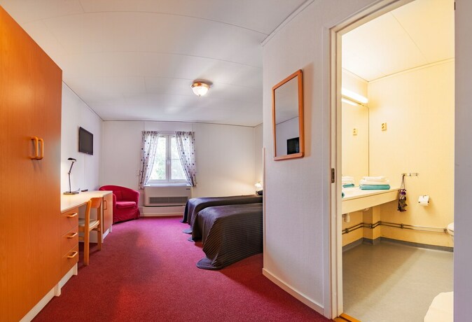 Imagen de la habitación del Hotel Swedish Village. Foto 23