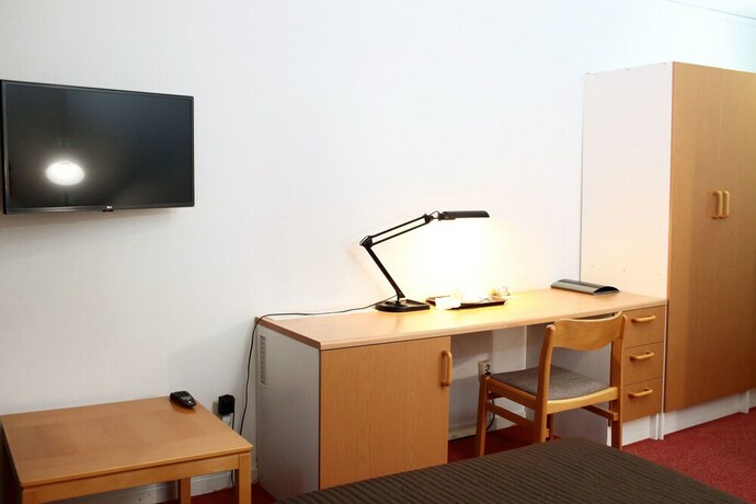 Imagen de la habitación del Hotel Swedish Village. Foto 29
