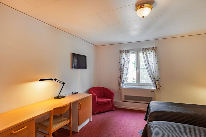 Imagen de la habitación del Hotel Swedish Village. Foto 34