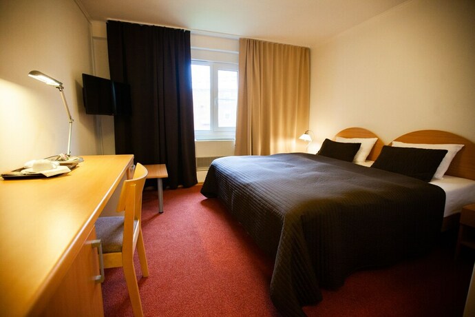 Imagen de la habitación del Hotel Swedish Village. Foto 35