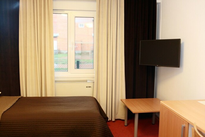 Imagen de la habitación del Hotel Swedish Village. Foto 39