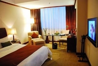 Imagen de la habitación del Hotel Swiss Belhotel Hualun. Foto 9