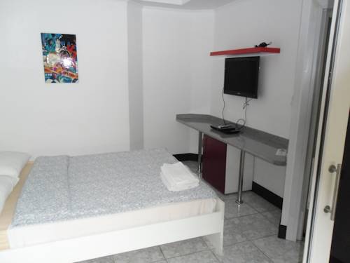 Imagen de la habitación del Hotel Swiss Food Restaurant And. Foto 12