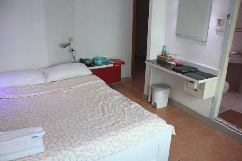 Imagen de la habitación del Hotel Swiss Food Restaurant And. Foto 16