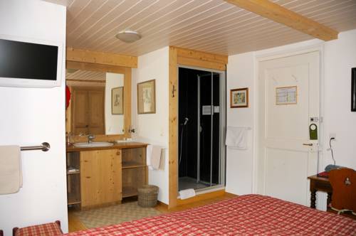 Imagen de la habitación del Hotel Swiss Historic Hotel du Pillon. Foto 2