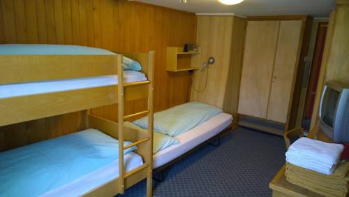 Imagen de la habitación del Hotel Swiss Lodge Bernerhof. Foto 7