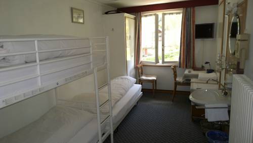 Imagen de la habitación del Hotel Swiss Lodge Bernerhof. Foto 11